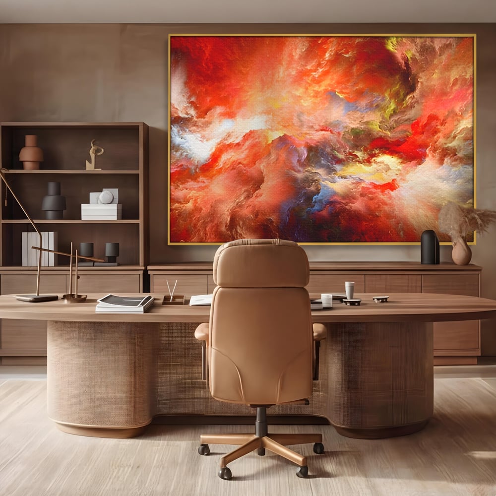Tablou canvas cu pictura abstracta cu nori rosii, in rama de aluminiu auriu, pe perete intr-un birou